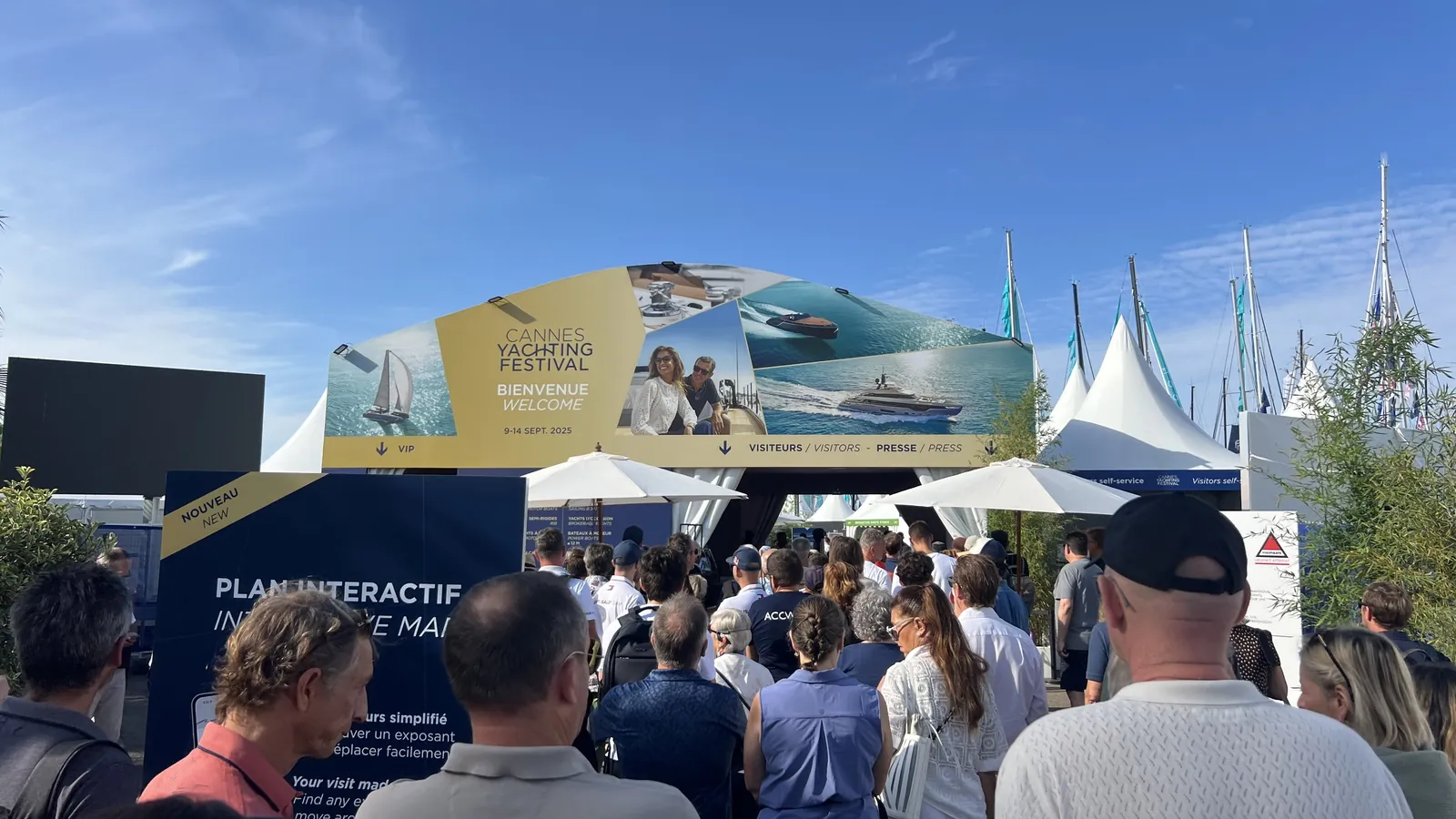 Visitors arriving at the Cannes Yachting Festival welcome arch