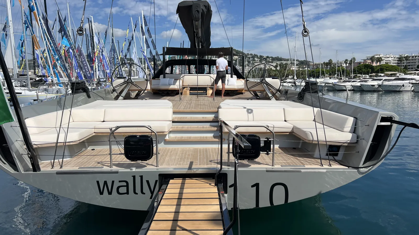 Teak foredeck and lounging cushions of a sailing yacht berthed at Cannes