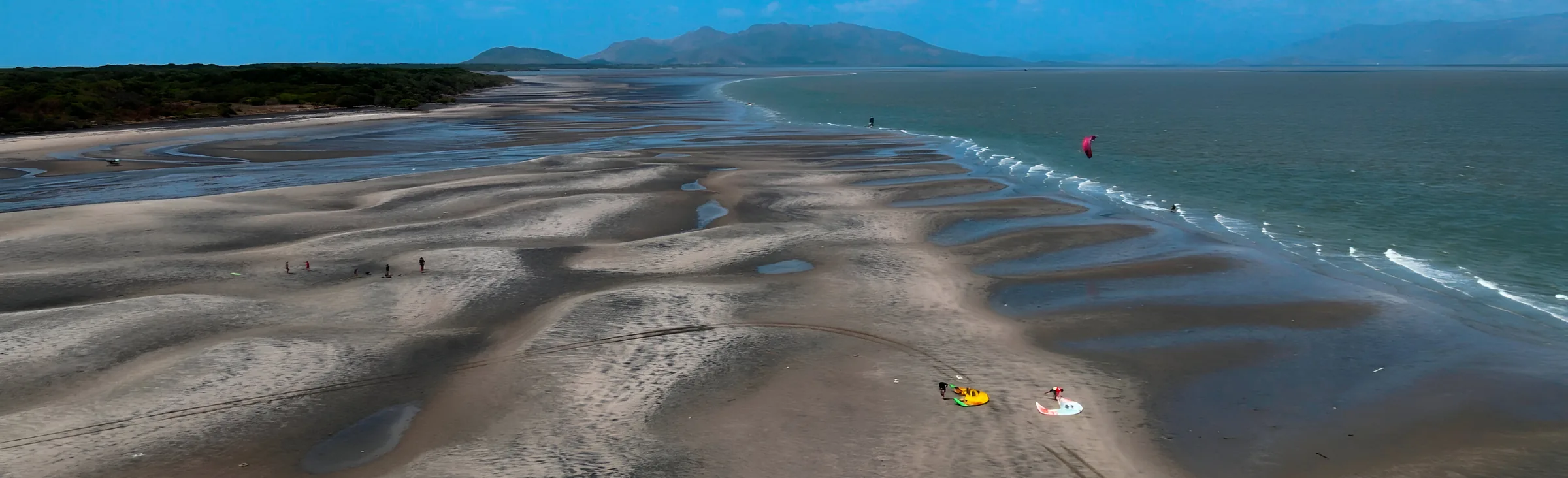 Punta Chame, Panama — tidal sandbars from the air with a kite aloft