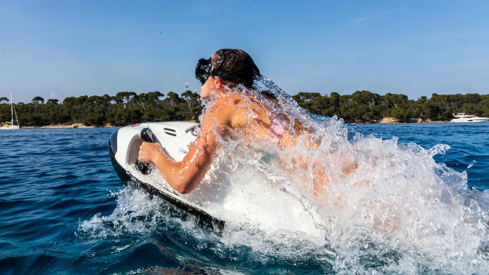 Charter guest having fun on a Seabob from the Sunreef 80 Endless Horizon